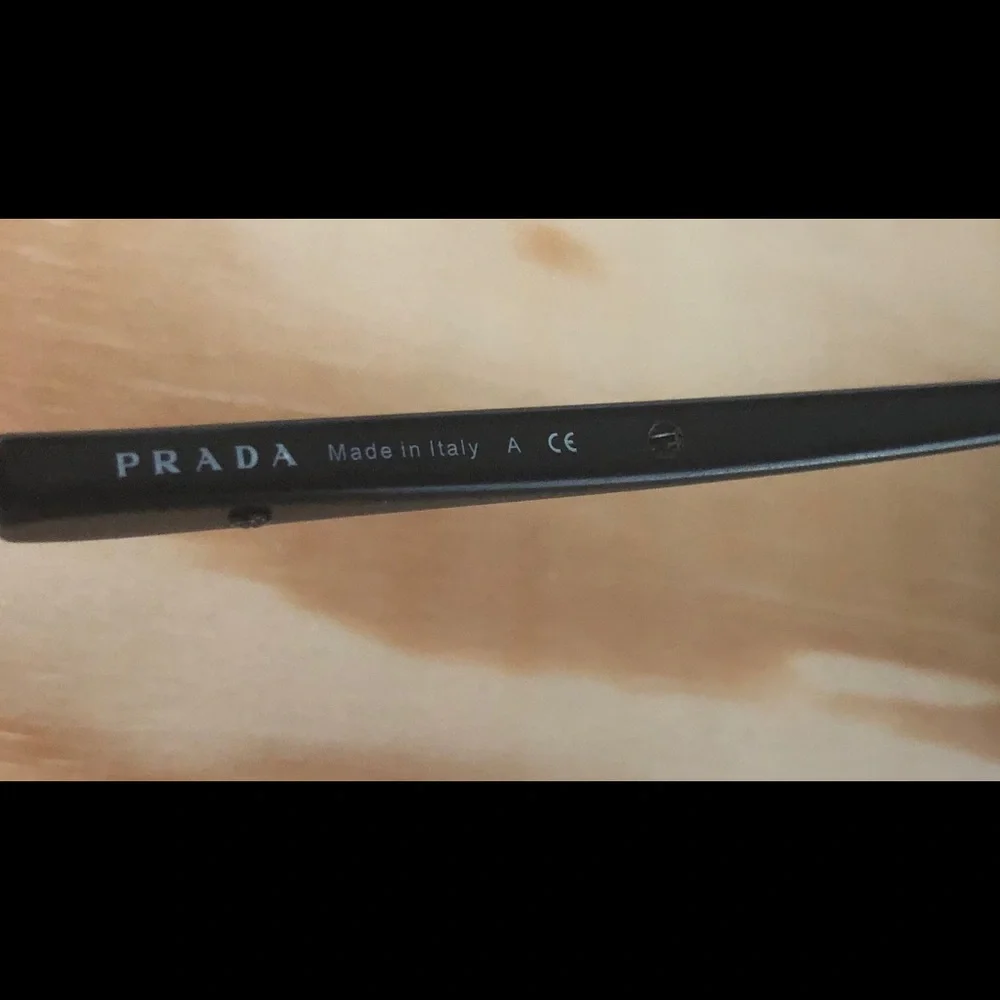 Prada Sunglasses.